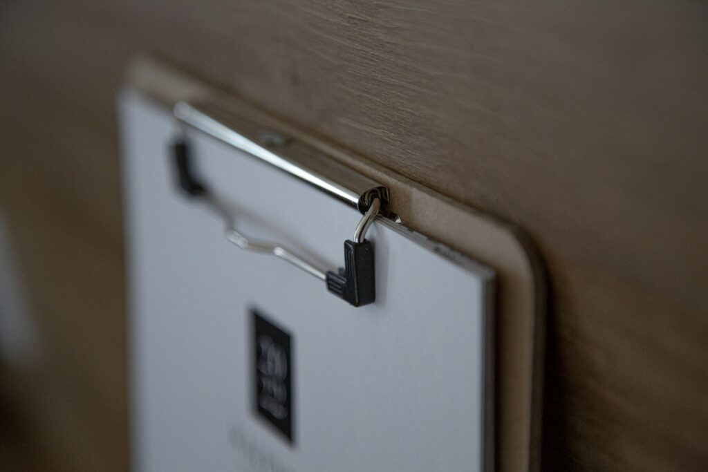 Inspection checklist on a clipboard — the visible part of an inspection that fits on a few pages, alongside the blind spots that don't.