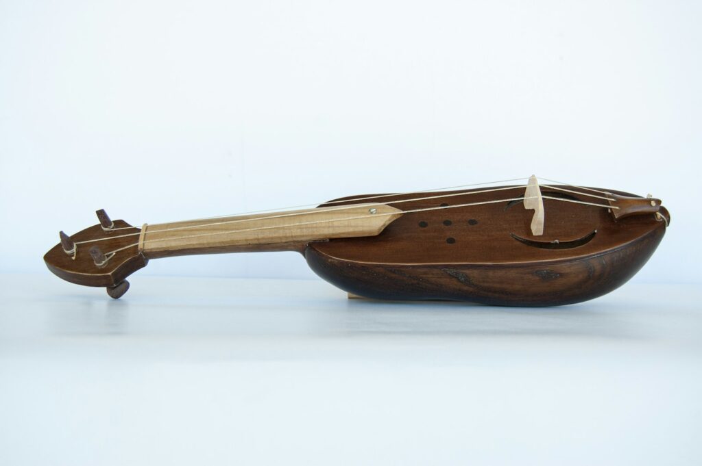 A 3-string rebec. The rebec is a bowed string instrument of the Medieval era and the early Renaissance.
