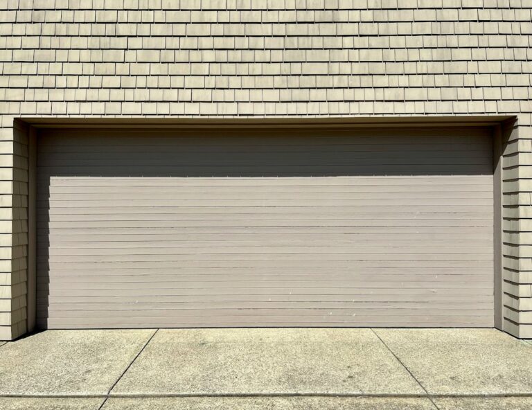 Garage Door Rollers: Nylon vs Steel, Wear Signs, and Safety